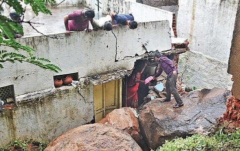 A boulder, weighing nearly 15 tonnes, fell on a vacant house at Dilawar Gunj in Mangalhat area of Dhoolpet. (Photo| EPS/S Senbagapandiyan)