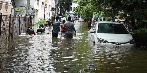 Vehicles and bikes were marooned in flood water after heavy rains in Hyderabad. (Photo | RVK Rao, EPS)