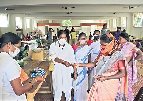 Medical staff distribute medicine to people at a rescue camp in Kompally on Friday. (Photo | EPS/vinay madapu)