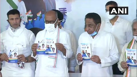 State Congress chief Kamal Nath releasing party manifesto for the bypolls on Saturday (Photo | Twitter/ANI)