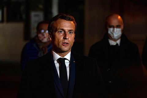 French President Emmanuel Macron speaks in front of a high school (Photo| AP)