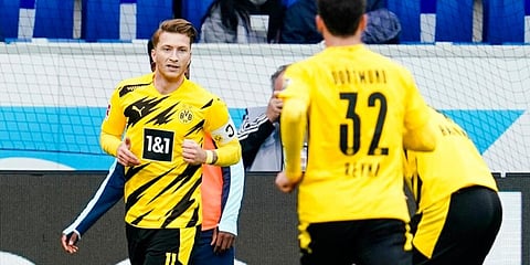 Borussia Dortmund's Marco Reus celebrates his with teammates during Bundesliga against TSG Hoffenheim. (Photo | AP)