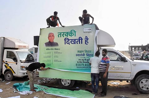 Workers prepare an election campaign rath for Janata Dal United ahead of Bihar Assembly polls in Patna Tuesday Oct 6 2020. (Photo | PTI)