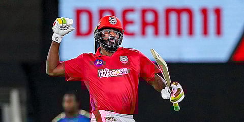 Kings XI Punjab batsman Chris Gayle celebrates after winning their IPL T20 match against Mumbai Indians at Dubai International Cricket Stadium. (Photo | PTI)