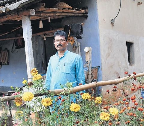 Tribal leader Chhatradhar Mahato at his Lalgarh residence. (Photo | EPS)