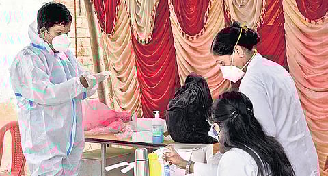 Health workers at a BBMP test camp in Vijayanagar on Sunday | Nagaraja Gadekal
