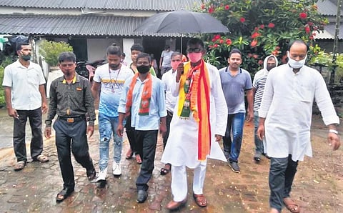 BJP candidate Rajkishore Behera campaigning with his supporters. (Photo | EPS)