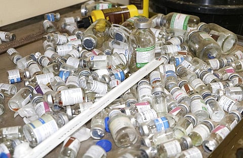 Empty vaccine bottles lie on a tray inside a small clinic in Gampela village on the outskirts of Burkina Faso's capital, Ouagadougou. (Photo | AP)