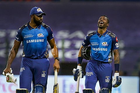 Mumbai Indians batsmen Kieron Pollard and Hardik Pandya during the Indian Premier League 2020 cricket match against Kings XI Punjab, at Sheikh Zayed Stadium. (Photo | PTI)