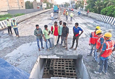 Labourers engaged in cutting the concrete slabs at Palarivattom flyover on Thursday as part of the second phase of demolition | Albin Mathew