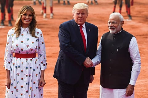 Prime Minister Narendra Modi (R) greets US President Donald Trump and First Lady Melania Trump during a ceremonial reception at Rashtrapati Bhavan(File | AFP)