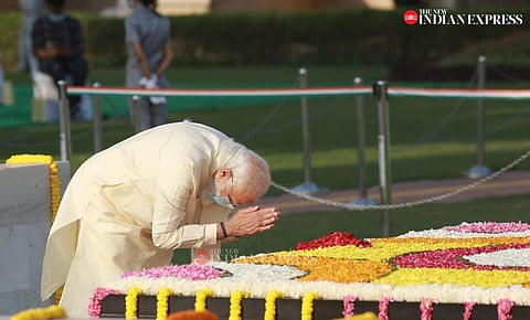 Prime Minister Narendra Modi pay homage to Mahatma Gandhi on his 151st birth anniversary at Rajghat in New Delhi on Friday. (Express photo | Shekhar Yadav)