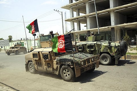 Afghan security personnel gather near a prison after an attack in the city of Jalalabad, east of Kabul, Afghanistan. (File Photo | AP)