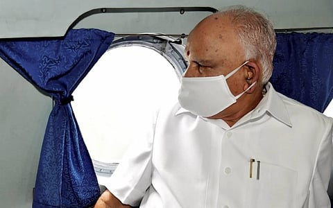 Karnataka CM BS Yediyurappa during an aerial survey to assess the extent of damage caused by the heavy rains in various districts of Karnataka. (Photo | PTI)