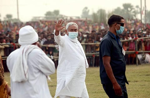 Bihar Chief Minister Nitish Kumar waves at the crowd during an election campaign rally ahead of Assembly elections in Jehanabad Tuesday Oct. 20 2020. (Photo | PTI)