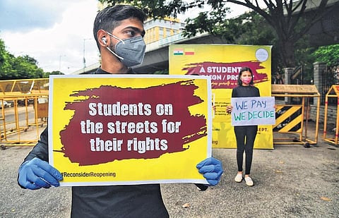Students stage protest against the government’s decision to reopen colleges, in Bengaluru on Saturday | shriram bn