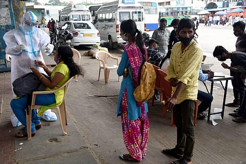 Mobile testing of COVID-19 taking place at Bengaluru's City Market on Monday. (Photo | Nagaraja Gadekal/EPS)