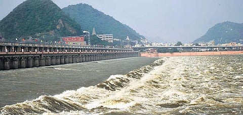 Flood water being released from Prasakam Barrage in Vijayawada on Thursday. (Photo| Prasant Madugula, EPS)