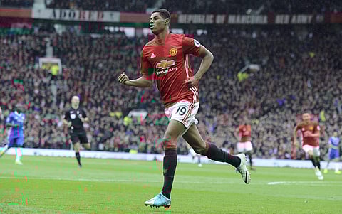 Manchester United's Marcus Rashford celebrates after scoring his side's first goal during the English Premier League soccer match between Manchester United and Chelsea at Old Trafford stadium in Manch