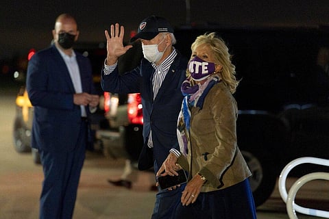 Democratic presidential candidate former Vice President Joe Biden and his wife Jill Biden arrive at New Castle Airport in New Castle, Del., Saturday, Oct. 24, 2020. (Photo | AP)