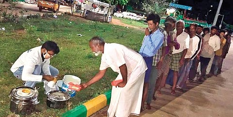 A member of Hands on Foundation distributing food to needy in Nellore. (Photo | Express)