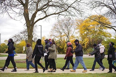 Voters and voting-enthusiasts participate in #walkthevote on Sunday, Oct. 25, 2020 in Southfield. (Photo | AP)