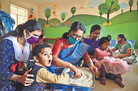 Little children were initiated into learning at several places across the State on the occasion of Vijayadasami on Monday. A scene at a school in city | R SATISH BABU