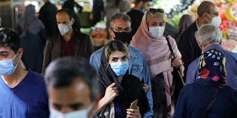 People wear protective face masks to help prevent the spread of the coronavirus in the Tajrish traditional bazaar in northern Tehran, Iran. (Photo | AP)