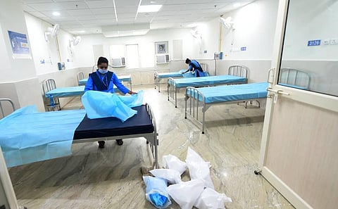 Workers make arrangements at a COVID-19 care centre. (File Photo | Shekhar Yadav, EPS)