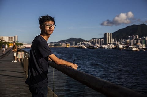Pro-democracy activist Tony Chung poses near the water in Hong Kong. (Photo| AFP)