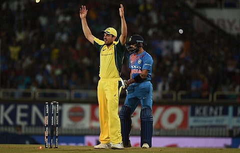 Australia's Moises Henriques (L) unsuccessfully appeals for a run-out as India's captain Virat Kohli looks on. (Photo | AFP)