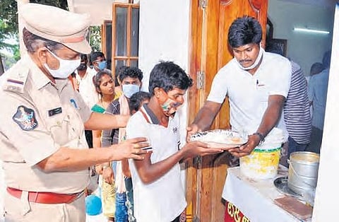 Police distribute food to the child labourers rescued as part of Operation Muskaan in Vijayawada on Wednesday | express