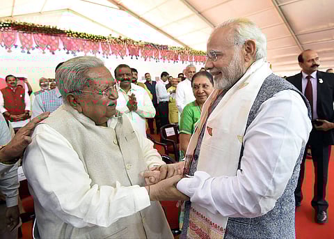 Prime Minister Narendra Modi greeting the former chief minister of Gujarat Keshubhai Patel at swearing-in ceremony. (File| PTI)