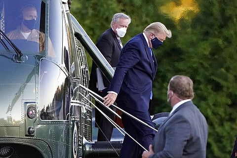 US President Donald Trump arrives at Walter Reed National Military Medical Center, in Bethesda, Md., Friday, Oct. 2, 2020, on Marine One after he tested positive for COVID-19. (Photo | AP)
