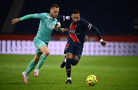 Paris Saint-Germain's Brazilian forward Neymar (R) vies for the ball with Angers' French midfielder Antonin Bobichon. (Photo | AFP)