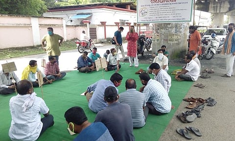 Farmers staging dharna near Collectorate in Sambalpur on Friday