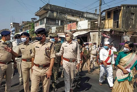 Police personnel conduct a flag march to enforce law and order in the area following clashes between police and public during 'Durga Puja' festival in Munger District Friday Oct. 30 2020. (Photo | PTI