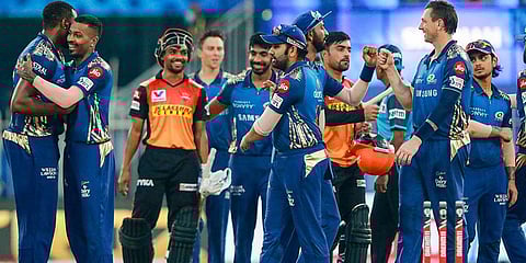Mumbai Indians celebrate after defeating Sunrisers Hyderabad at an IPL match at Sharjah Cricket Stadium. (Photo| PTI)