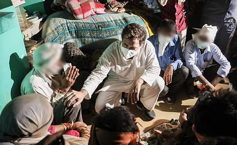 Congress leader Rahul Gandhi meets the family members of a 19-year-old Dalit woman who died after being allegedly raped two weeks ago at Bulgadi village in Hathras Saturday Oct. 3 2020. (Photo | PTI)