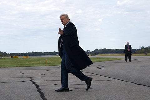 President Donald Trump arrives at Morristown Municipal Airport to attend a fundraiser at Trump National Golf Club in Bedminster, Thursday, Oct. 1, 2020, in Morristown, N.J. (Photo | AP)