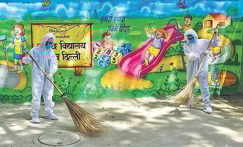Sweepers clean a school premises even as schools remain shut during. (File Photo)