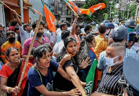 BJP workers stage a protest against the state government in Kolkata (Photo | PTI)
