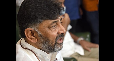 KPCC president D K Shivakumar addresses supporters in front of his residence in Bengaluru, after the CBI raided 14 of his properties across the country. (Photo | Nagaraja Gadekal, EPS)