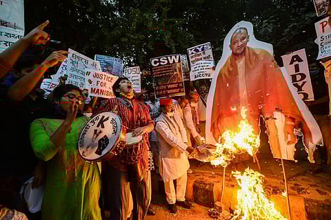 All India Students Association AISA and Samajwadi Party workers burn effigy Of UP CM Yogi Adityanath during a protest over the Hathras incident at Jantar Mantar (Photo | PTI)