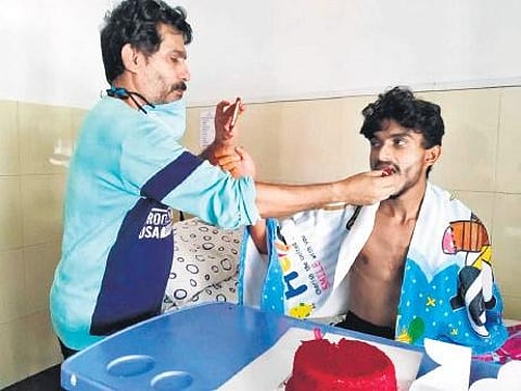 Arjun with his father Rajan on his birthday before the surgery