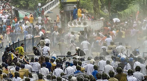 Police baton charge to disperse Bharatiya Janta Yuva Morcha activists during the protest in Kolkata. (Photo | PTI)