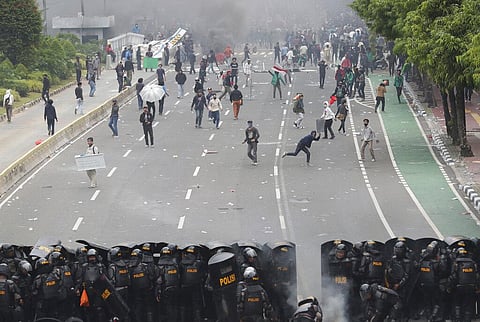 Police confront protesters during a rally in Jakarta, Indonesia, Thursday, Oct. 8, 2020. (Photo | AP)