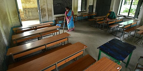 A classroom in Montessori School, Vijayawada being cleaned as the government prepares to resume classes from Monday. (Photo| Prasant Madugula, EPS)