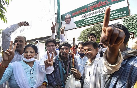 JDU supporters react as officials count votes during counting day of Bihar Assembly polls in Patna Tuesday Nov. 10 2020. (Photo | PTI)