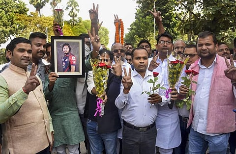 RJD supporters celebrate their party leader Tejashwi Prasad Yadav's birthday outside his residence in Patna Monday Nov. 9 2020. (Photo | PTI)